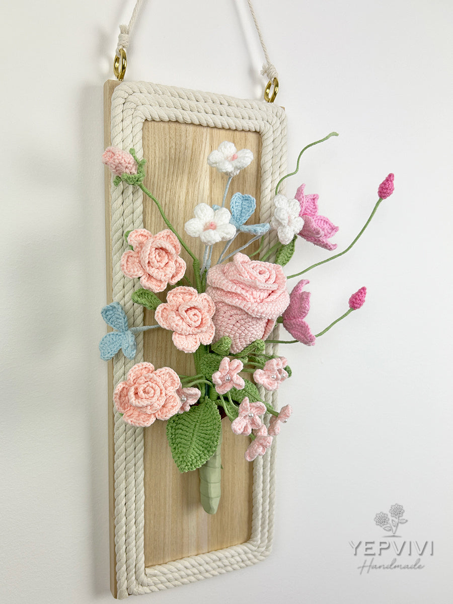 Finished crochet flowers with wood wall hanging. Pink rose and clematis arrangement wall art.