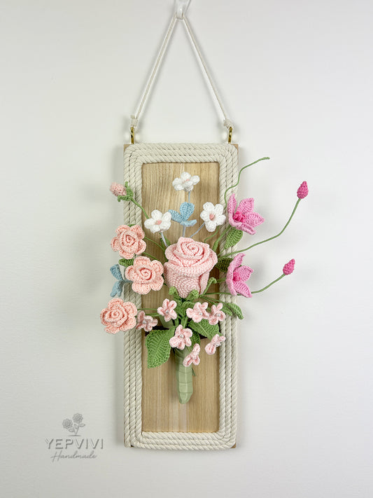 Finished crochet flowers with wood wall hanging. Pink rose and clematis arrangement wall art.