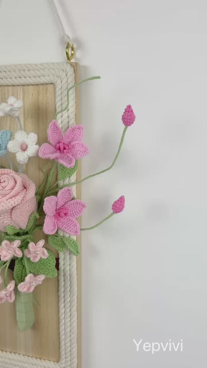 Finished crochet flowers with wood wall hanging. Pink rose and clematis arrangement wall art.